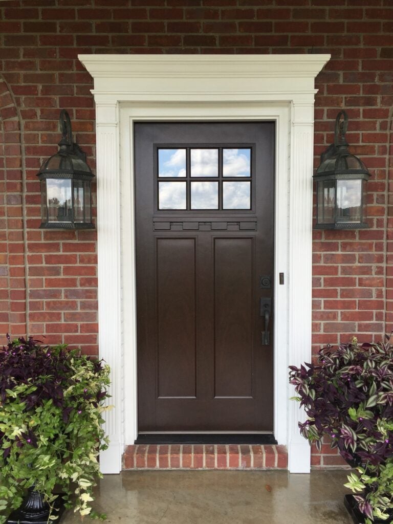 Mahogany craftsman style front entry door with white colonial trim Brickhouse entryway